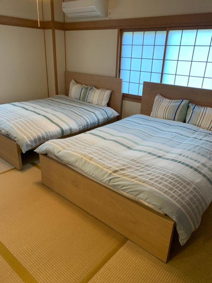 Guest House Apple Ōsaka Exterior foto